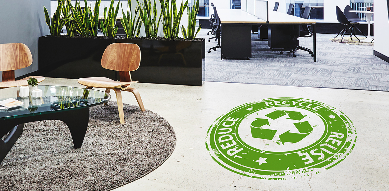 Green marketing concept graphic displayed on a company floor