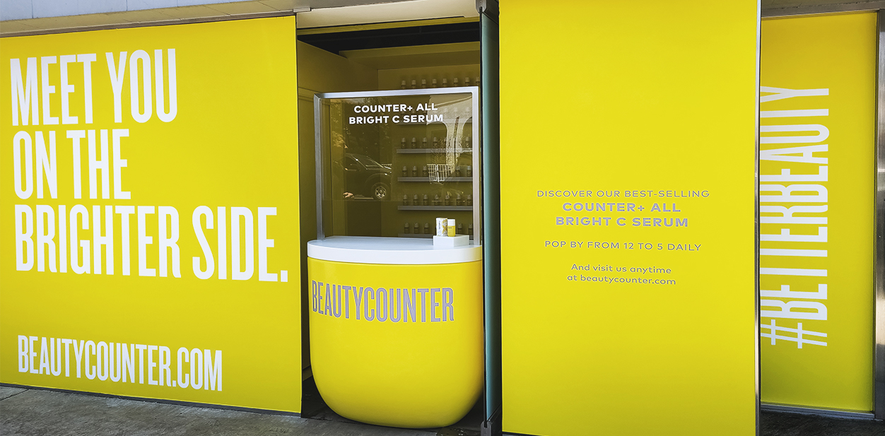 Beautycounter storefront design and window branding in yellow