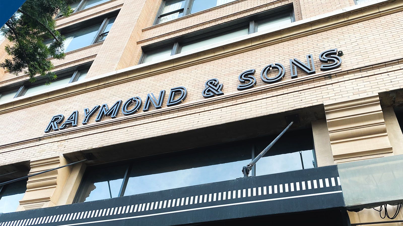 Raymond and Sons storefront sign