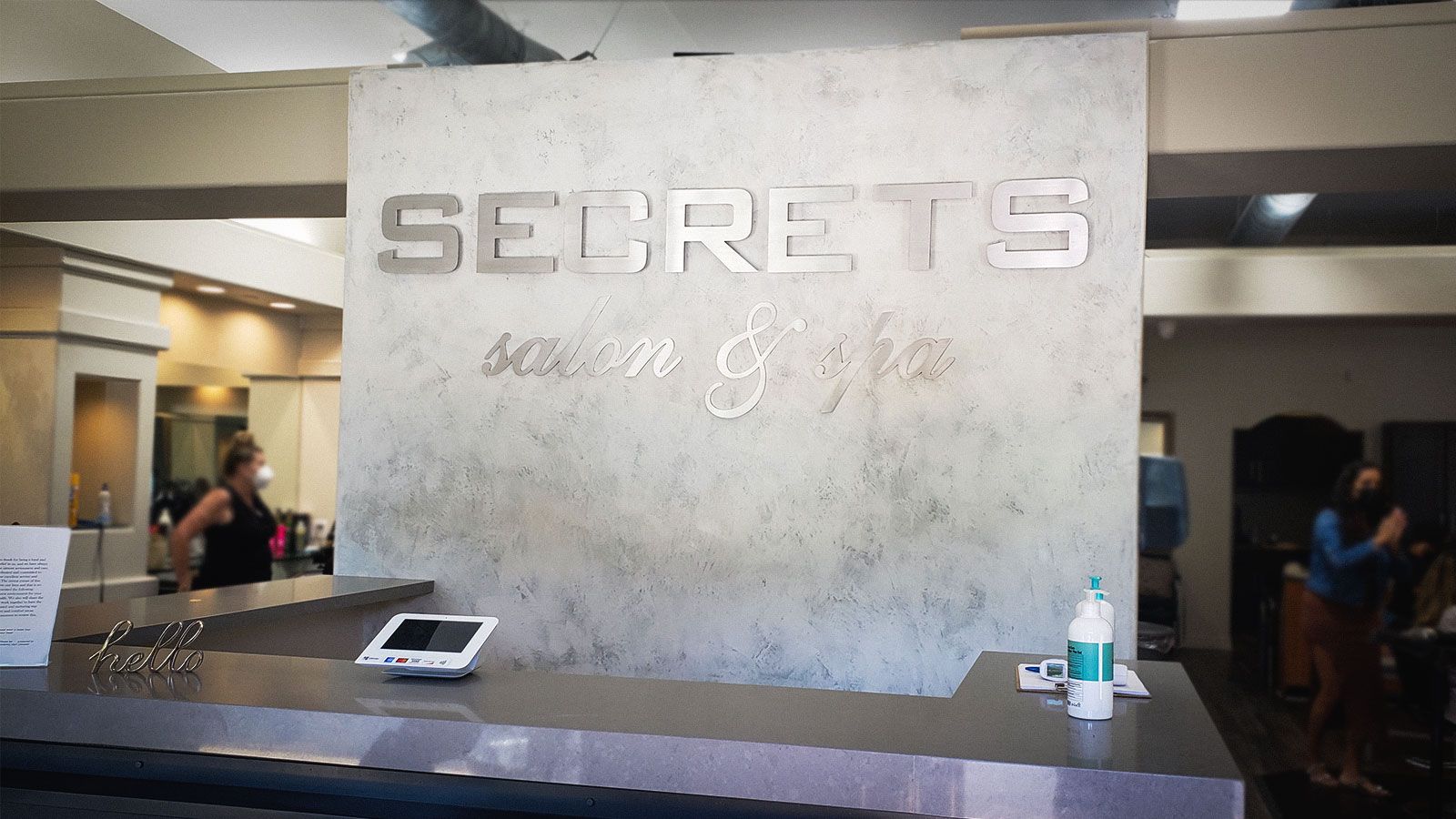 Secrets salon front desk signs