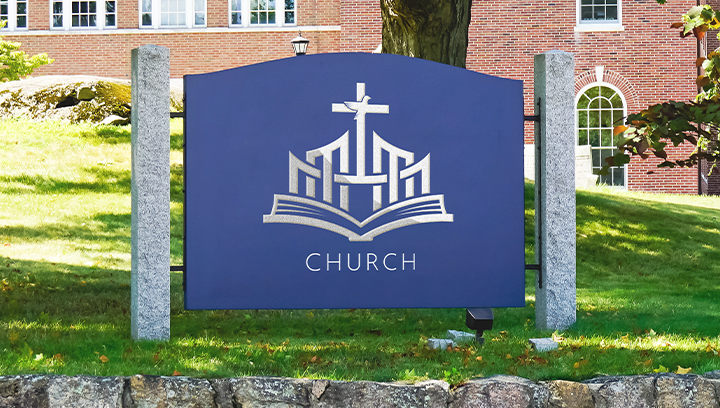 church monument sign in blue color displaying the church logo outdoors