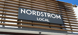 Nordstrom Local push through letters in white made of aluminum and acrylic