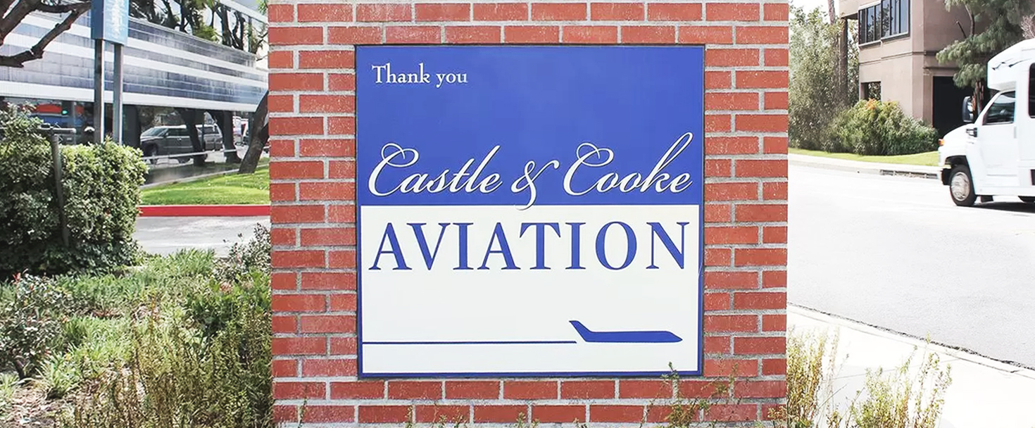 Castle & Cook Aviation outdoor monument sign with a brick wall in a pylon style made of PVC