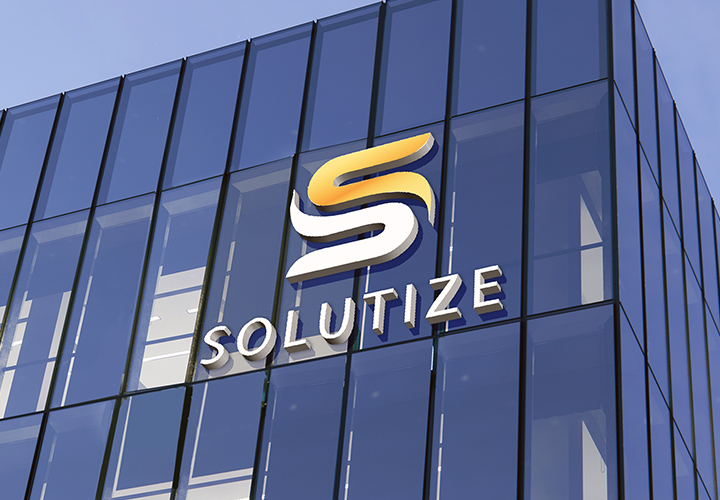 Solutize brand high rise sign on top of a building