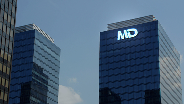 MD tall tower sign in white displaying the brand logo