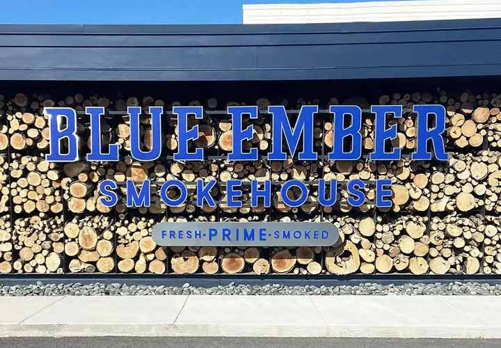 Blue Ember exterior building sign in blue made of aluminum and acrylic for branding