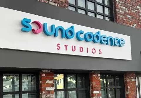 Building signs for Sound Cadence Studios in cyan and pink on a white background