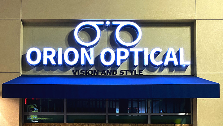 Orion Optical illuminated building sign made of aluminum and acrylic