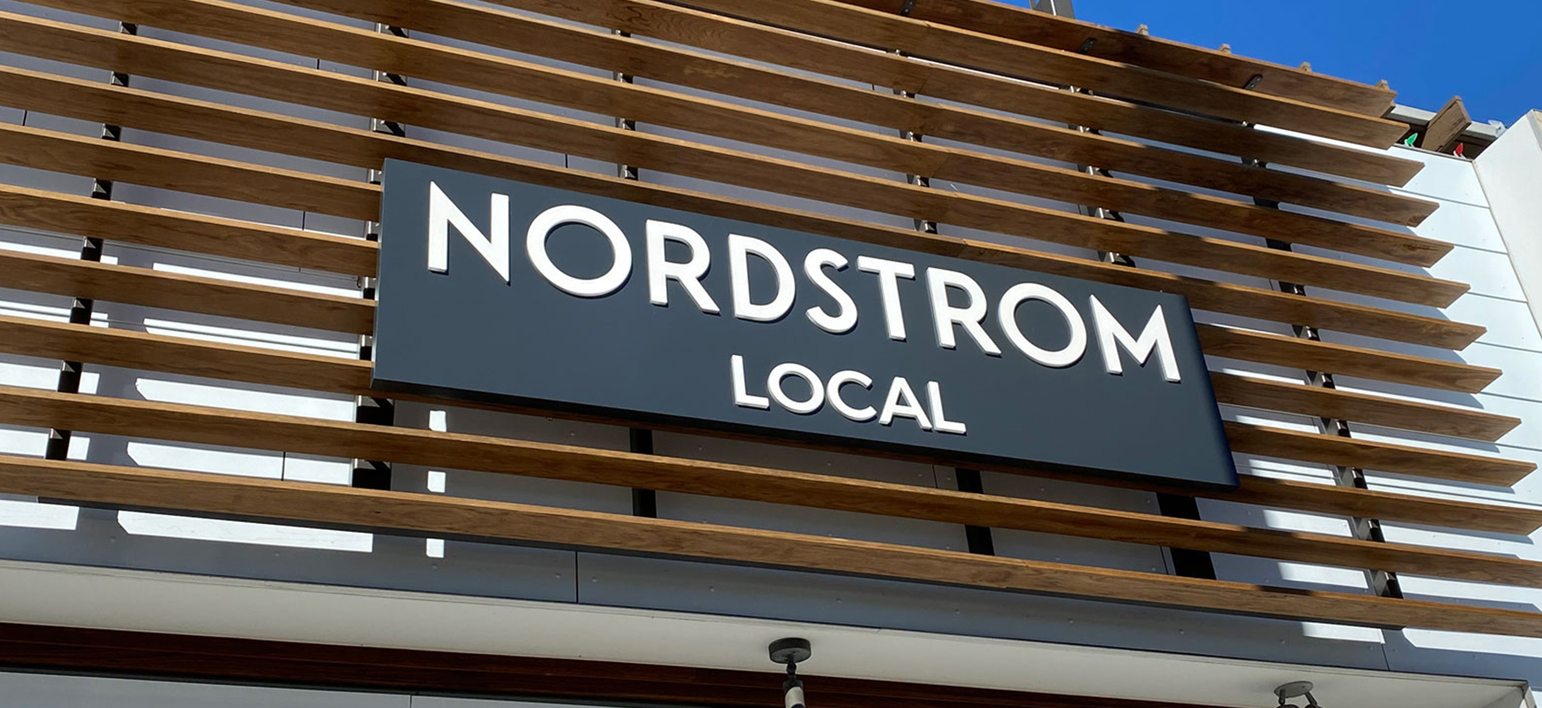 Nordstrom Local commercial building sign with white letters made of aluminum and acrylic