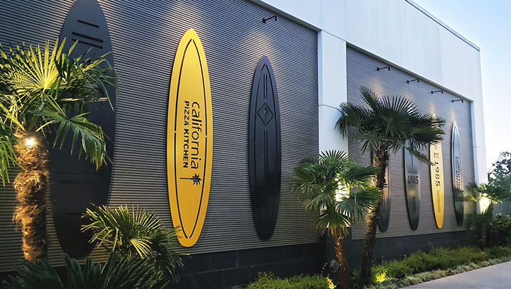 California Pizza Kitchen custom outdoor building signs in surfboard shapes made of aluminum