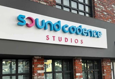 Sound Cadence Studios building sign displaying brand name made of aluminum and acrylic