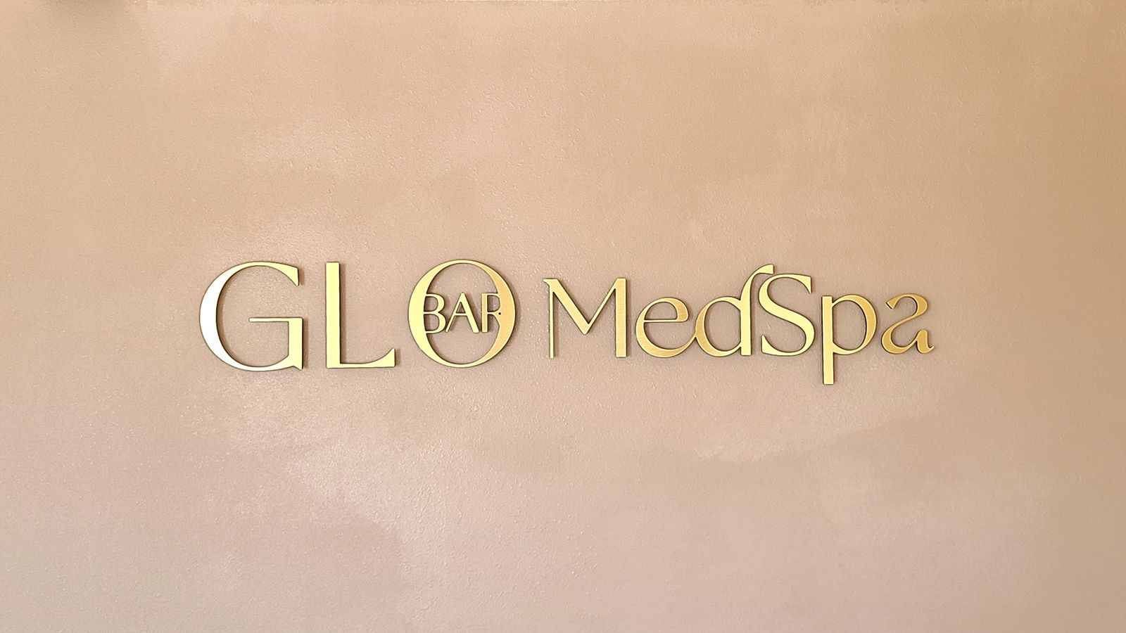 glo bar medspa office sign