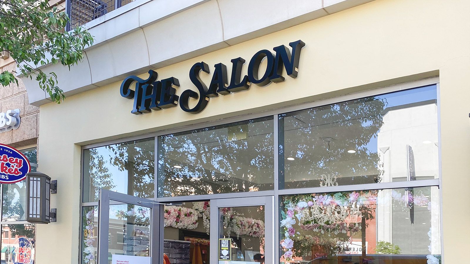 the salon storefront sign