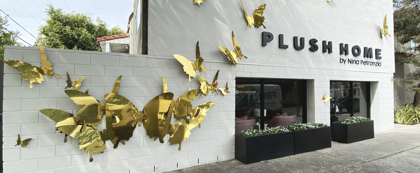 Plush Home custom outdoor sign with golden butterflies made of aluminum for building branding