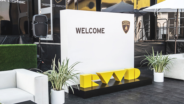 Lamborghini custom outdoor event sign with the brand name and logo made of aluminum and wood