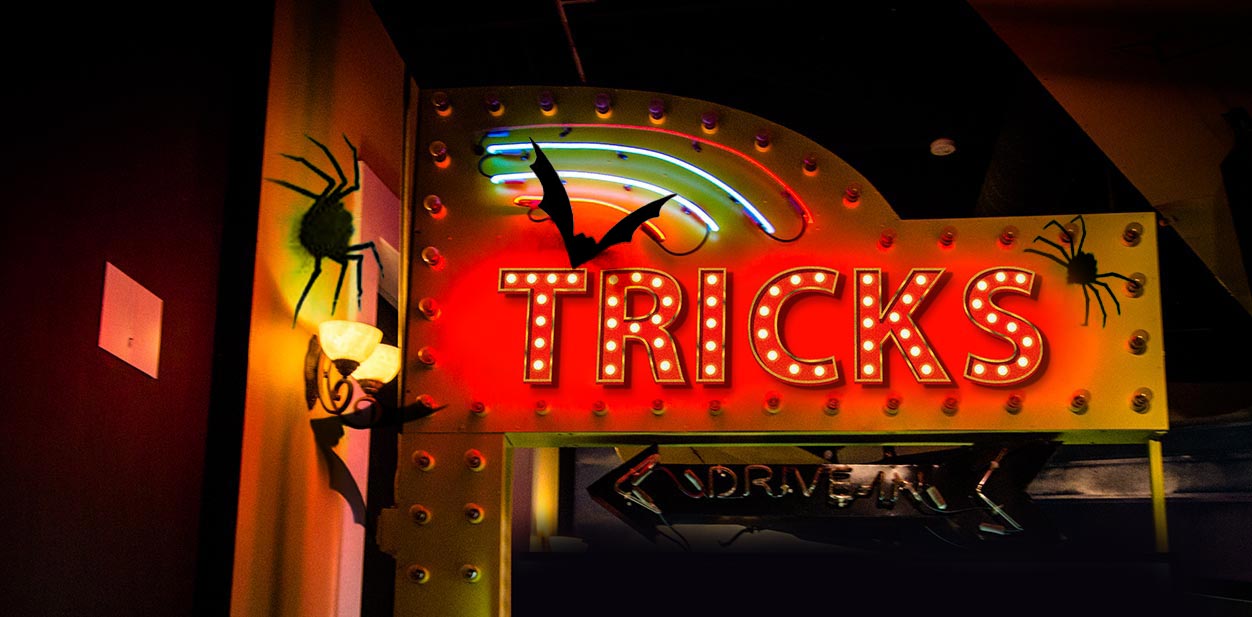 Lighted Halloween sign displaying the word Tricks