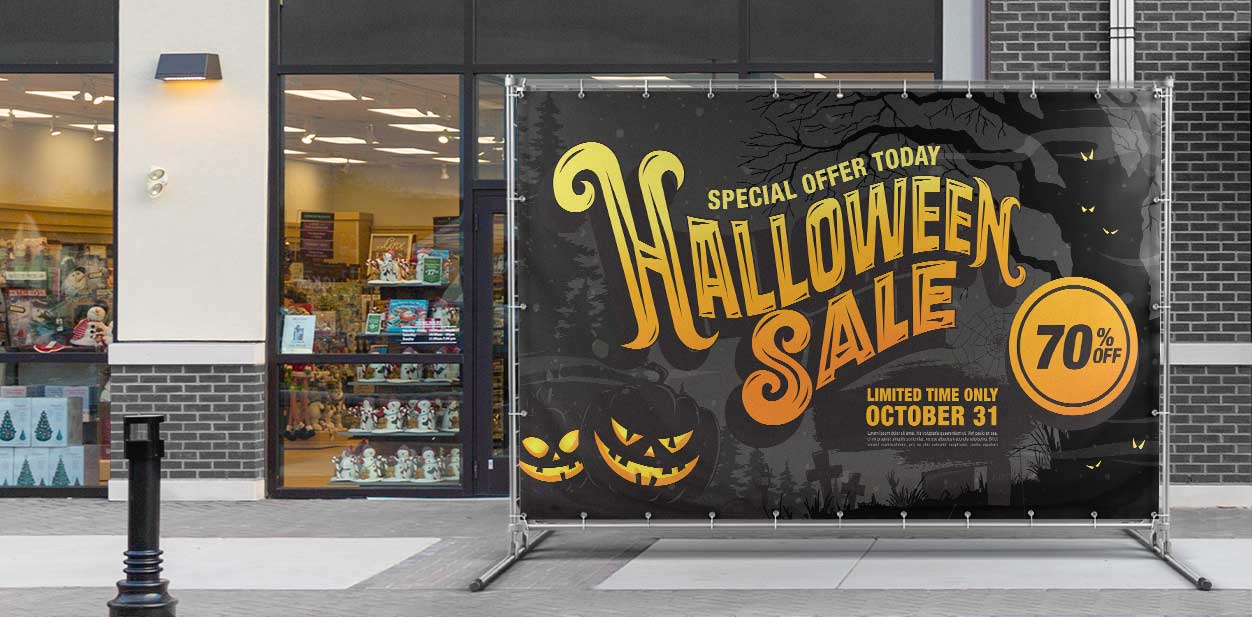 Large promotional Halloween backdrop in black placed at the storefront