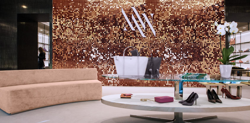 Large sequin wall in golden color for store interior design