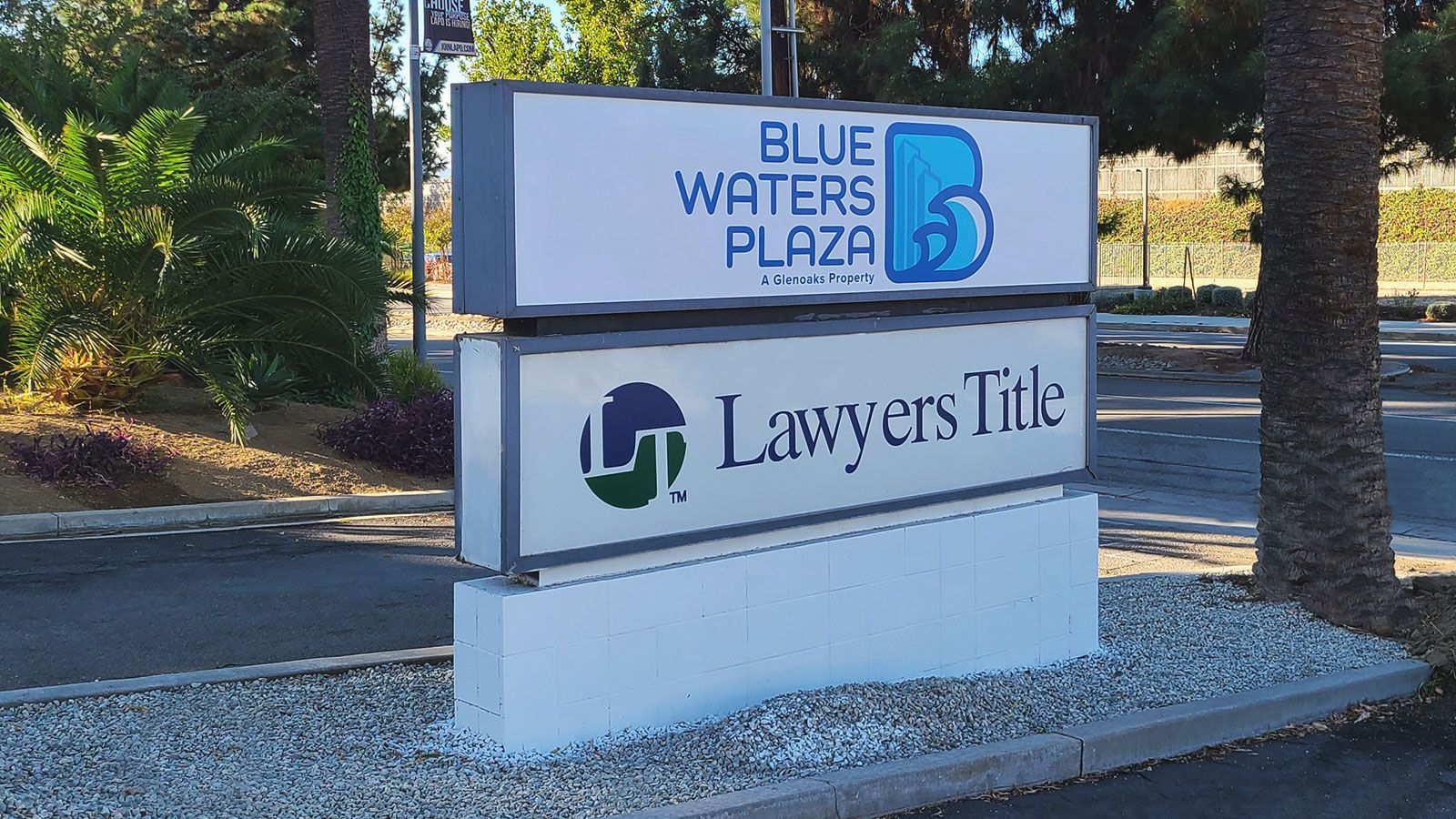 blue waters plaza outdoor sign