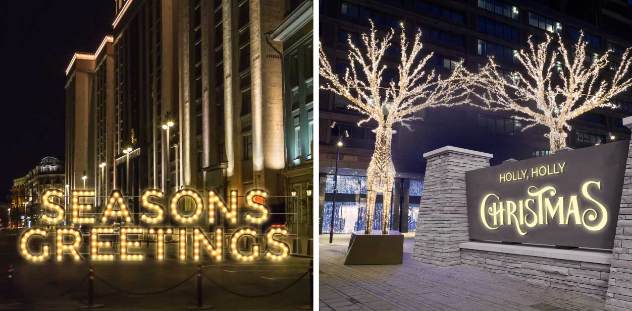 Large Christmas signs displaying holiday sayings