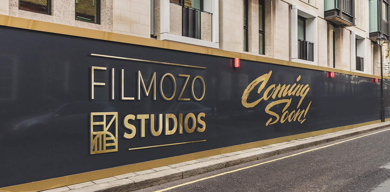 Filmozo Studios OOH hoarding in black and gold with a Coming Soon display for branding purposes