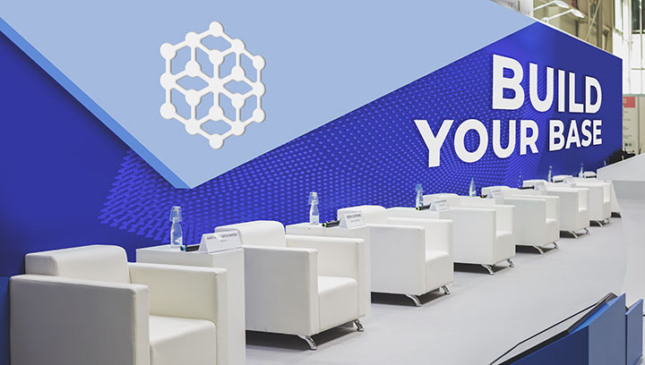 White and blue conference graphics and logo for public events with a slogan 'BUILD YOUR BASE'