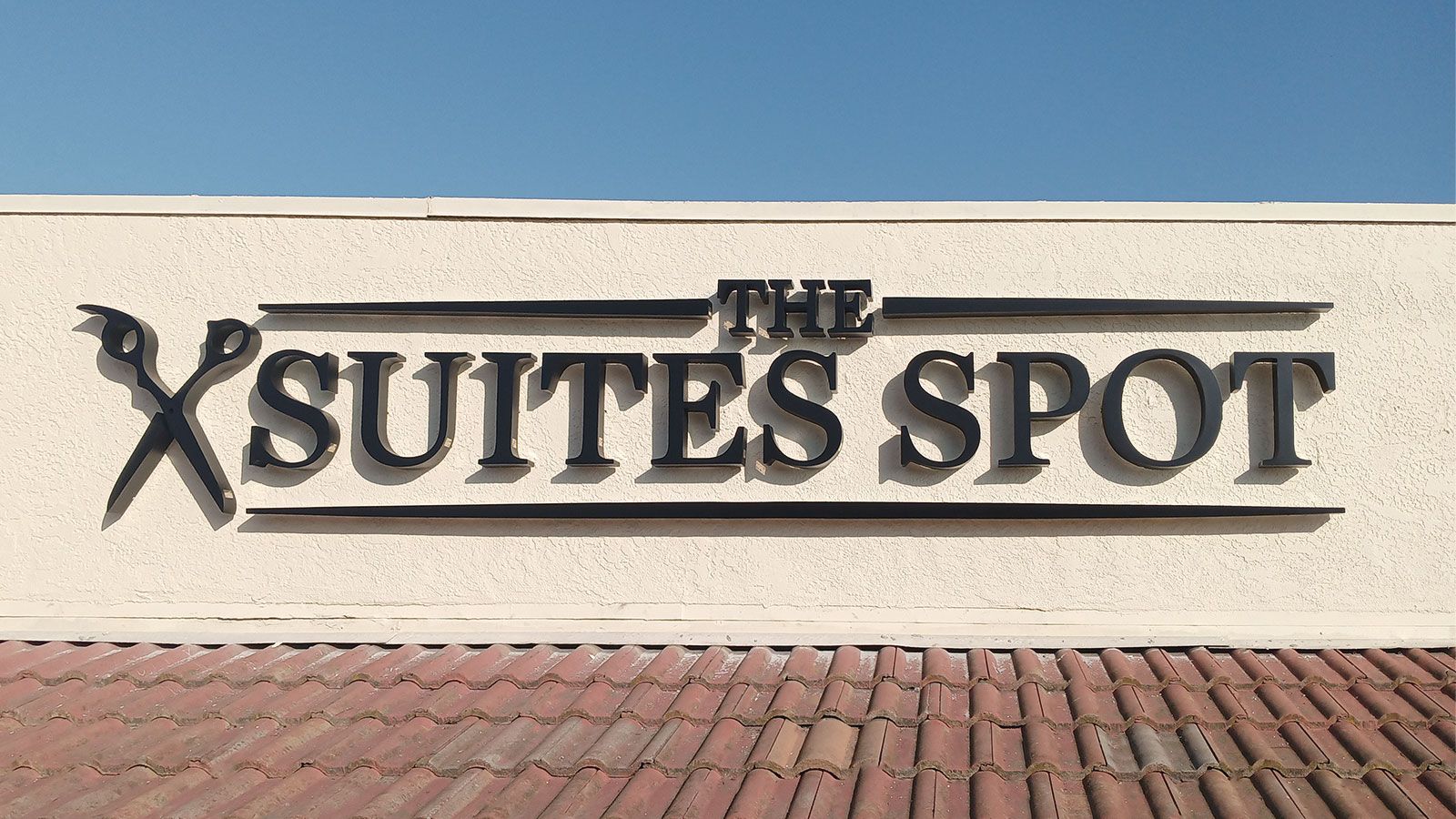 suites spot high rise sign