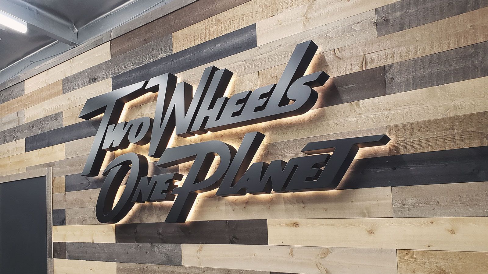 two wheels one planet led sign
