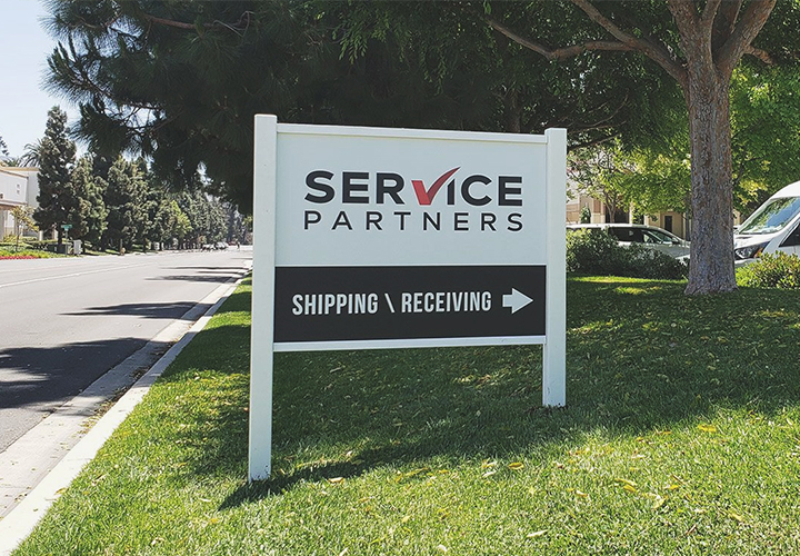 Self-standing outdoor board for 'Service Partners' with directional features