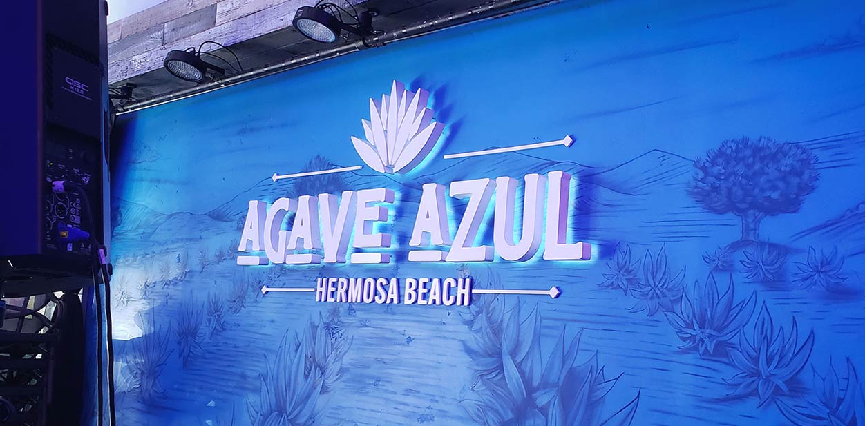Blue and white interior design featuring Agave Azul with white letters on blue background