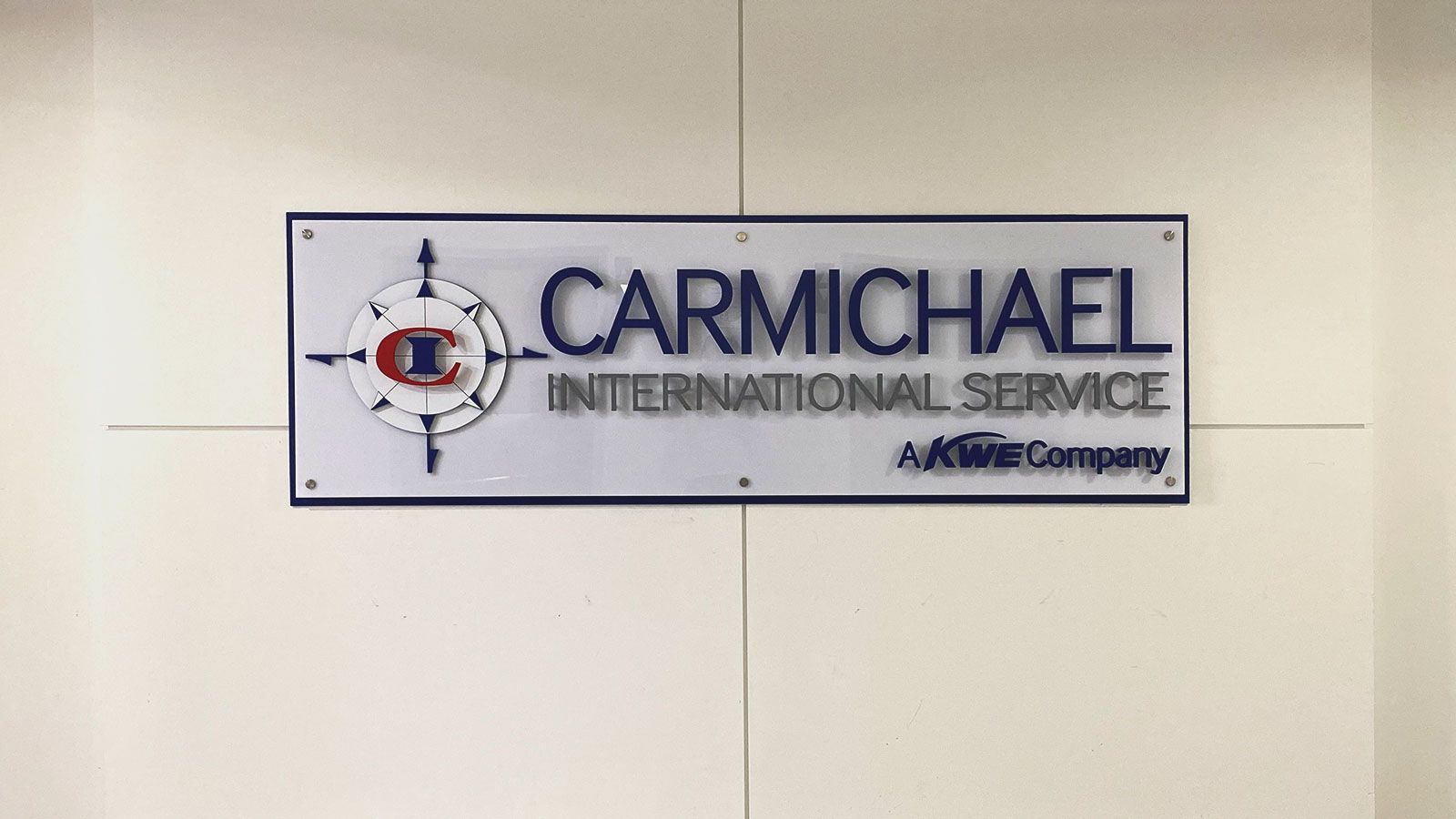 carmichael international service acrylic sign