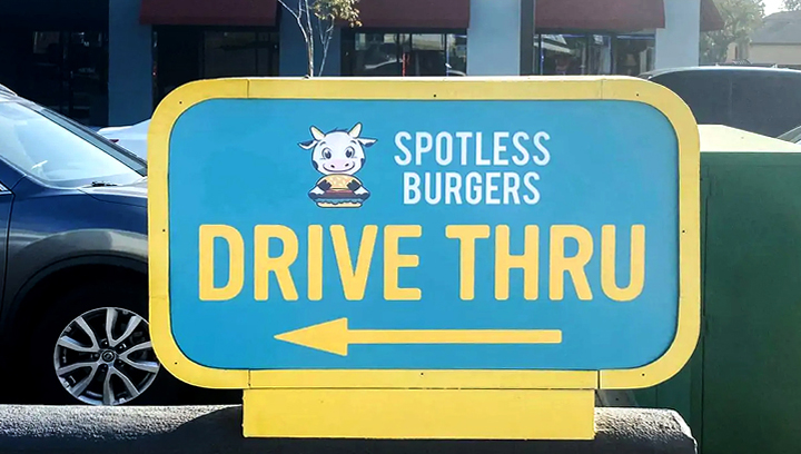 Spotless Burgers storefront wayfinding sign made of acrylic