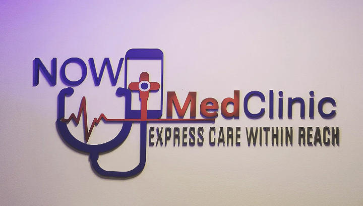 custom interior medical office sign mounted on the wall and featuring 'Now MedClinic'