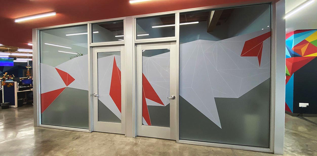 Opaque vinyl window adhesives for El Clasificado with colorful graphics.