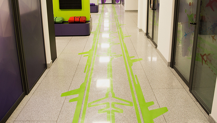 Electric green floor wayfinding graphics made of opaque vinyl