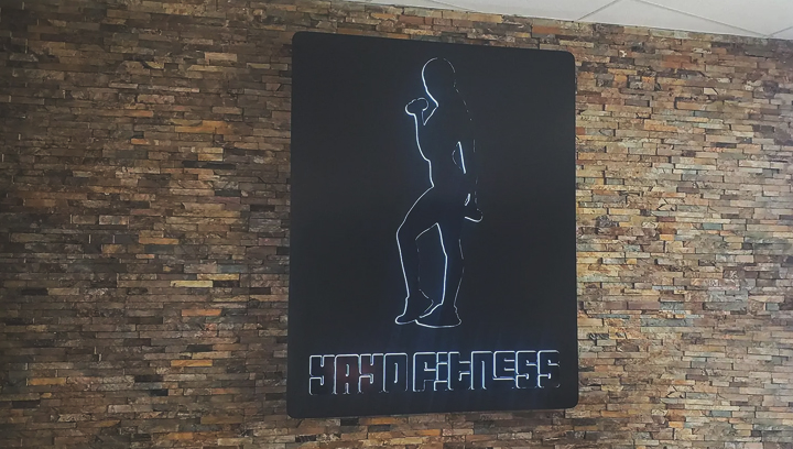 Yayo Fitness gym wall sign in black