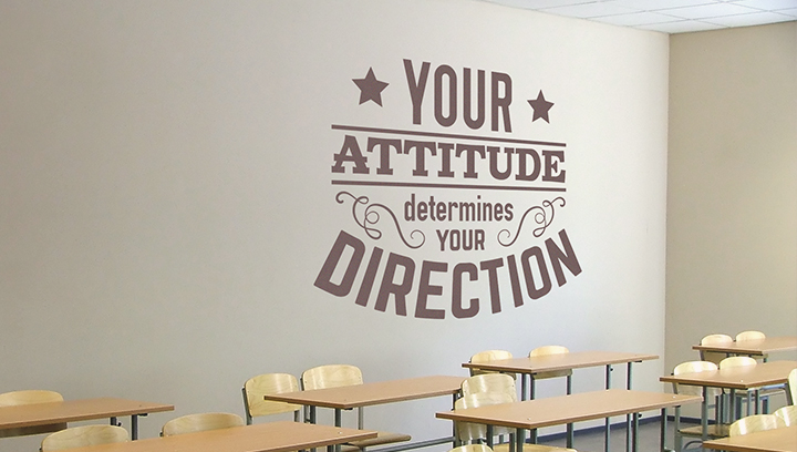 Inspiring slogan 'Your Attitude Determines Your Direction' on the classroom wall