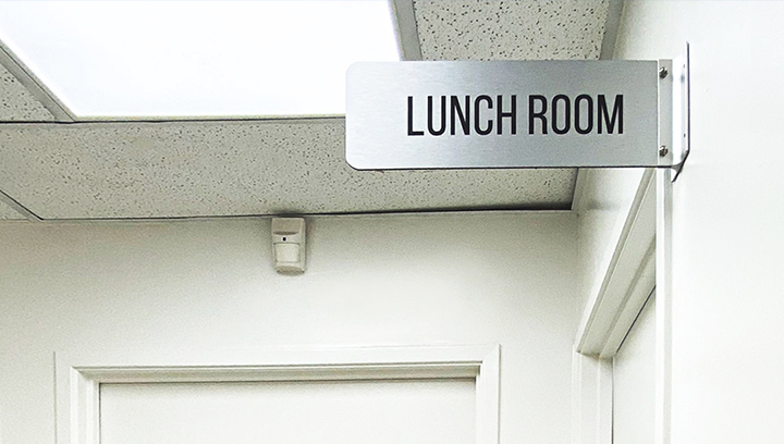 Lunch Room aluminum wayfinding sign in a wall blade style