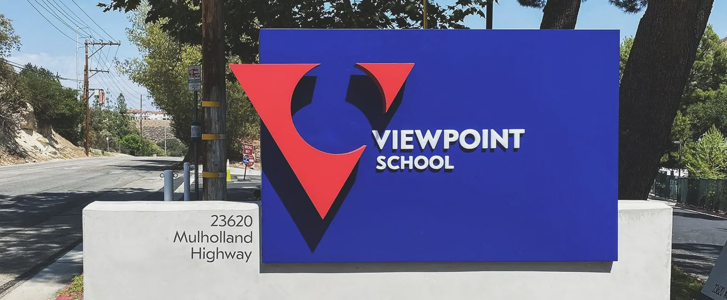 Ground-mounted exterior Viewpoint School sign featuring logo and school name