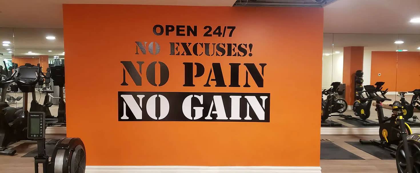 large gym sign displaying a motivational quote made of opaque vinyl for interior wall branding