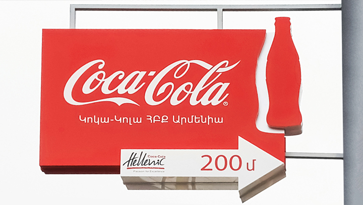 Coca Cola acrylic directional sign in red in a custom style