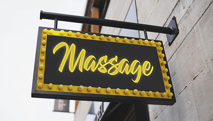 Retro style massage spa sign in black and yellow