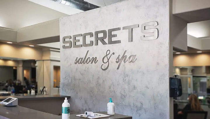 Secrets salon and spa sign for the lobby area 2