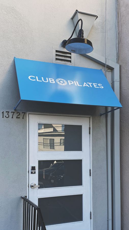 Club pilates aluminum canopy sign