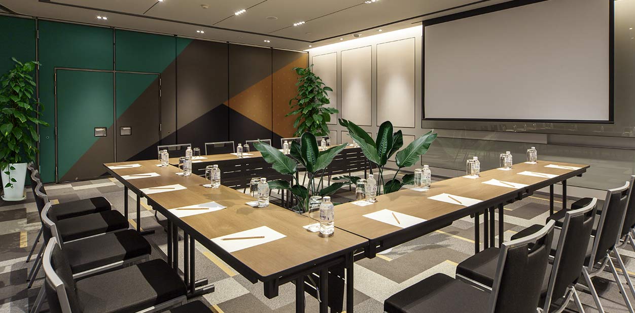 Comfortable furniture, useful utensils and natural plants in meeting room design