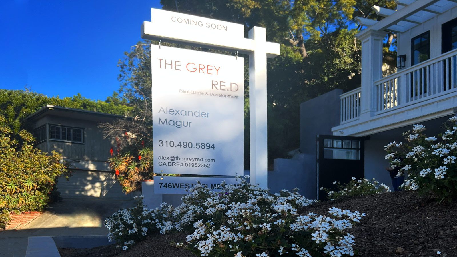 The grey real estate sign