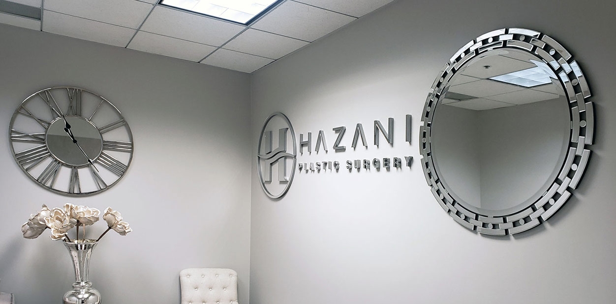 Hazani office reception design concept with the company's logo and name