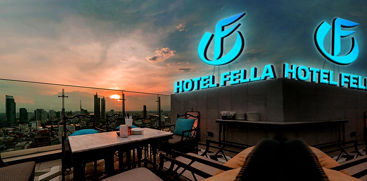 Hotel Fella rooftop branding design with an illuminating hotel name and logo and a cozy seating
