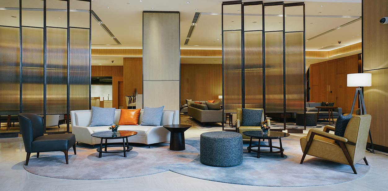 Lobby design ideas with furniture and glass partitions in the middle of the room
