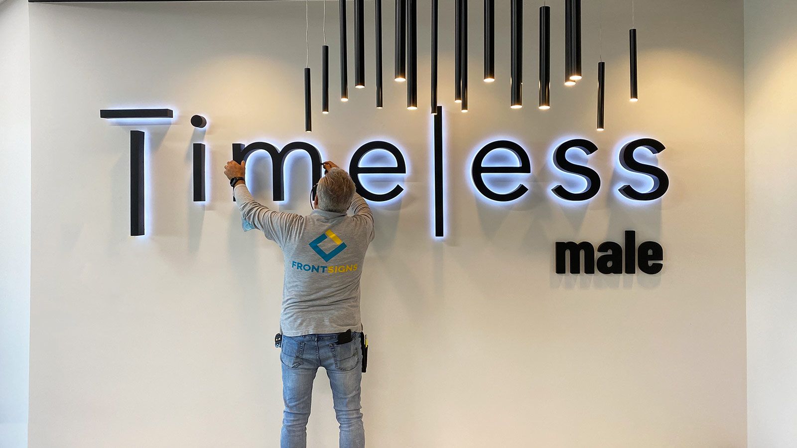 timeless male led sign installation